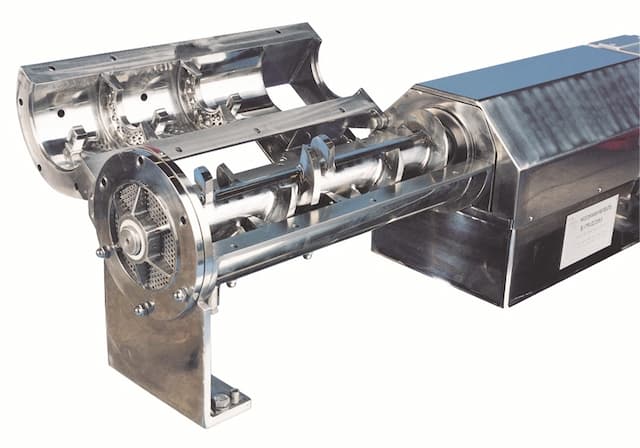 Continuous extruder for mixing solids and liquids