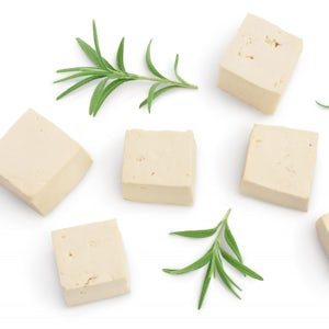 Blocks of plant-based cheese placed on a white surface