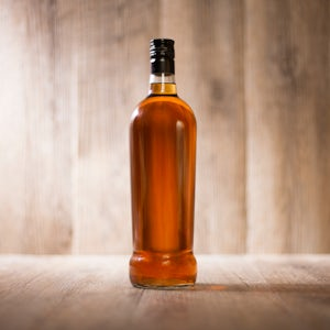 rum bottle on a wooden surface