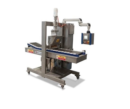 Production machine for deposited candies and jellies