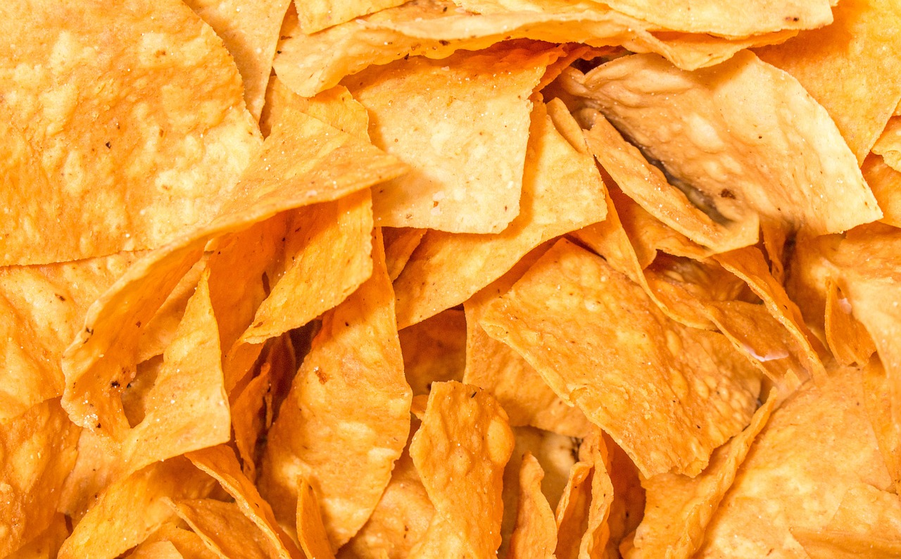 Corn cooking systems for tortilla chips