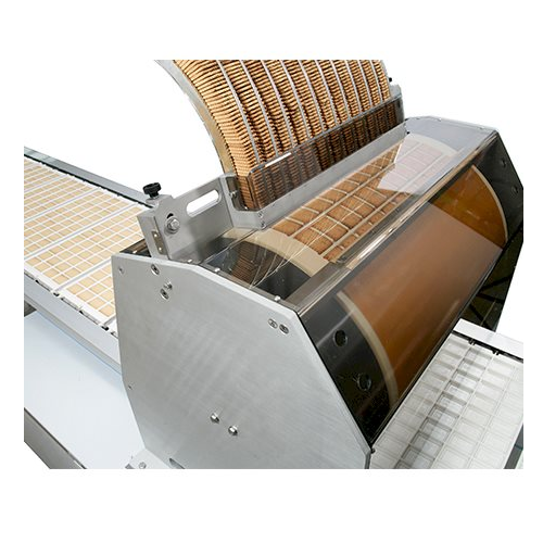 Wafer and biscuit feeder for chocolate moulding