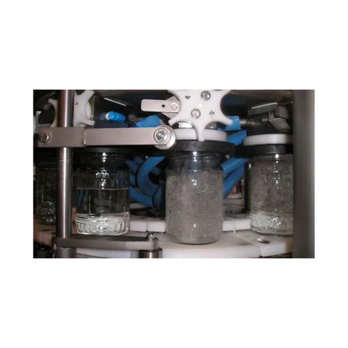 Vacuum filler for glass jars and cans