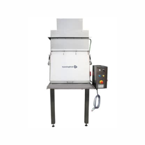 Dust control sack tip station for bag unloading