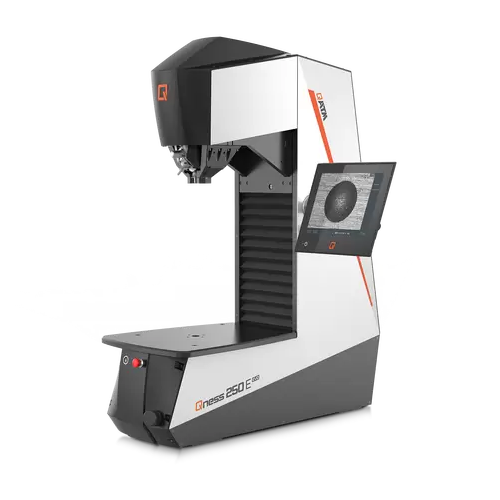 Macro hardness tester with dynamic height adjustment