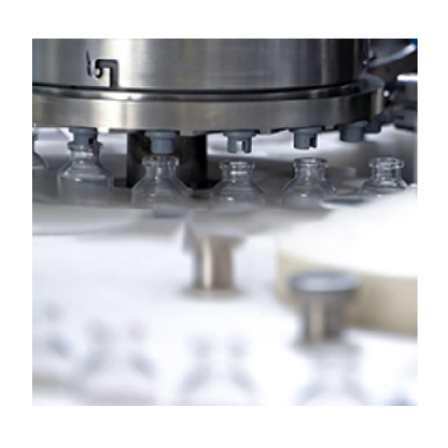 Continuous motion rotary vial filling and stoppering solution