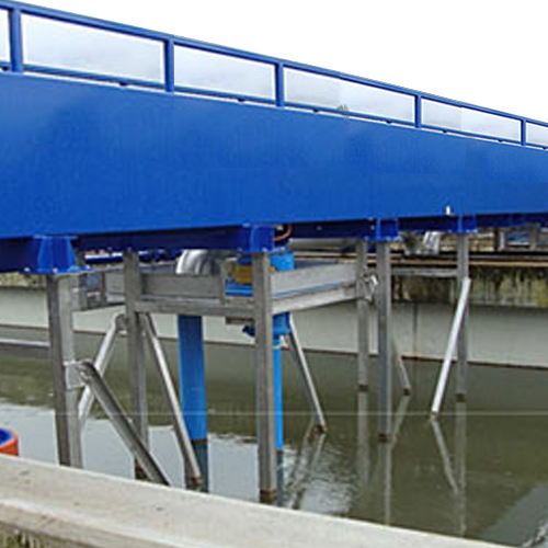 Travelling bridges for sludge removal in wastewater treatment plants