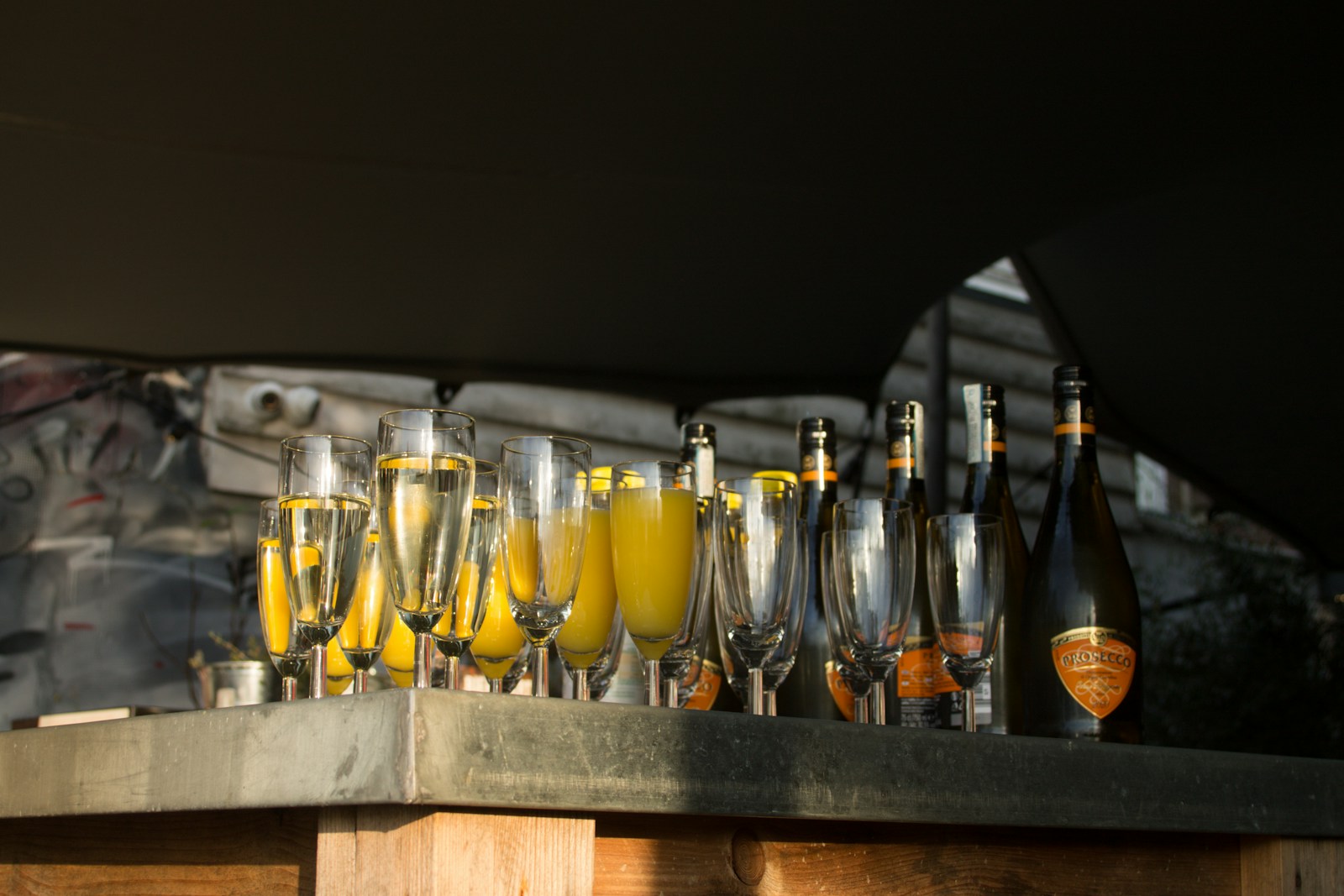 a table topped with lots of glasses filled with drinks