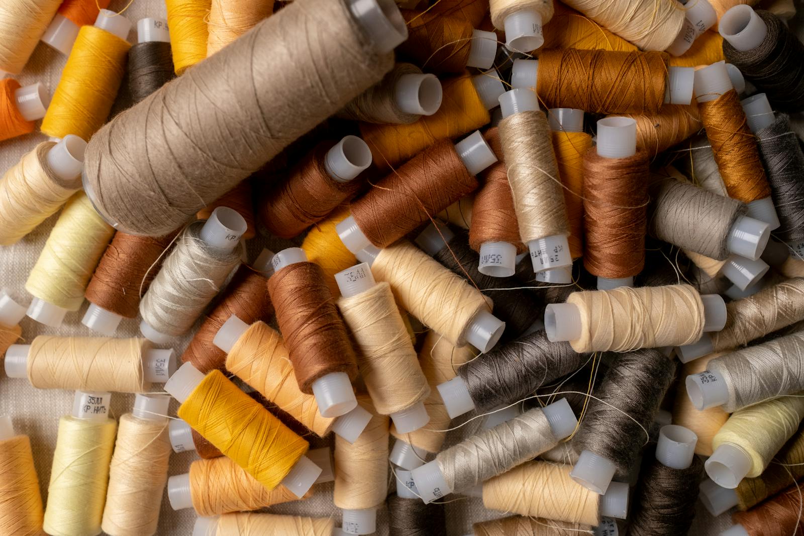 Top view of colorful thread spools ideal for sewing and craft projects.