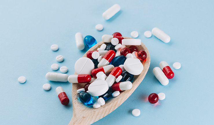 In-process weighing system for capsules and tablets