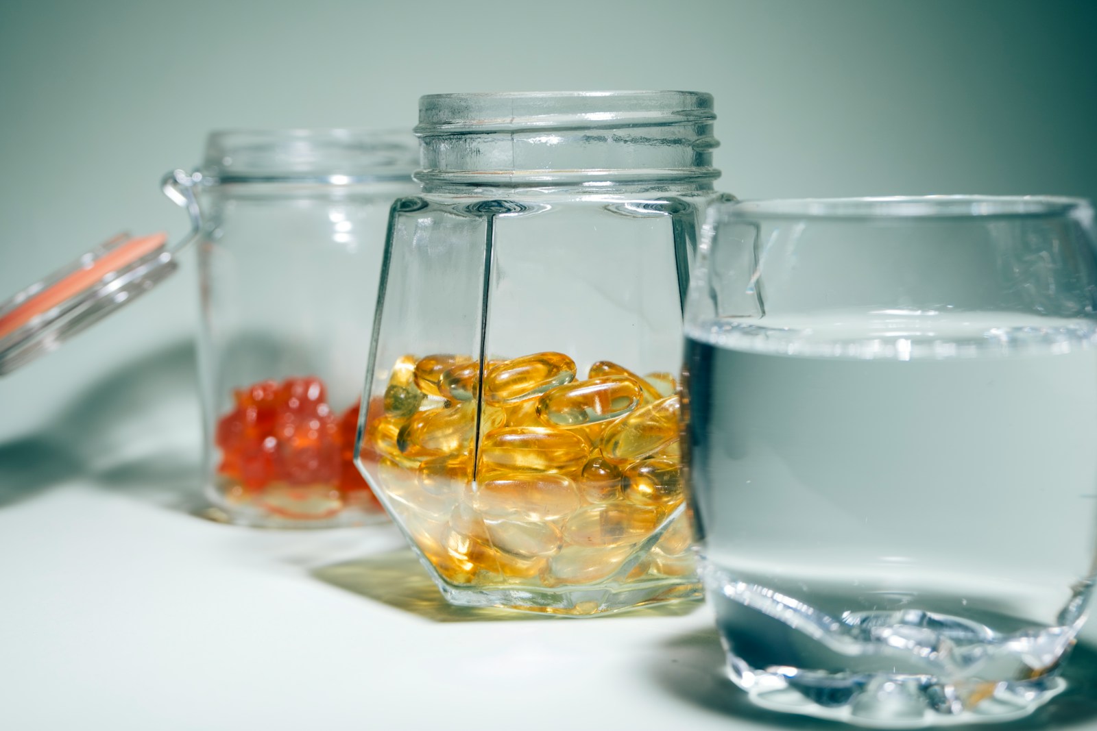 Three glass jars filled with different types of liquid