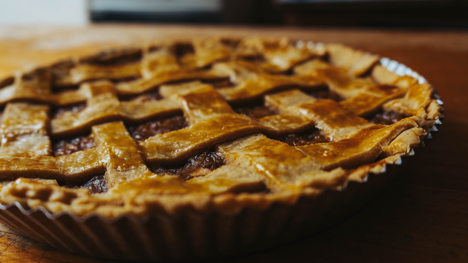 a pie sitting on top of a wooden table