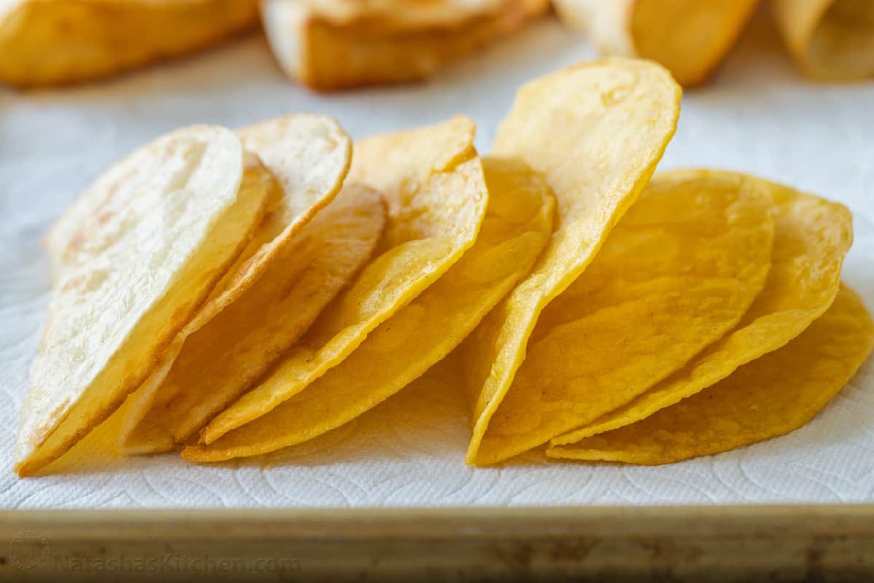 Corn cooking systems for tortilla chips