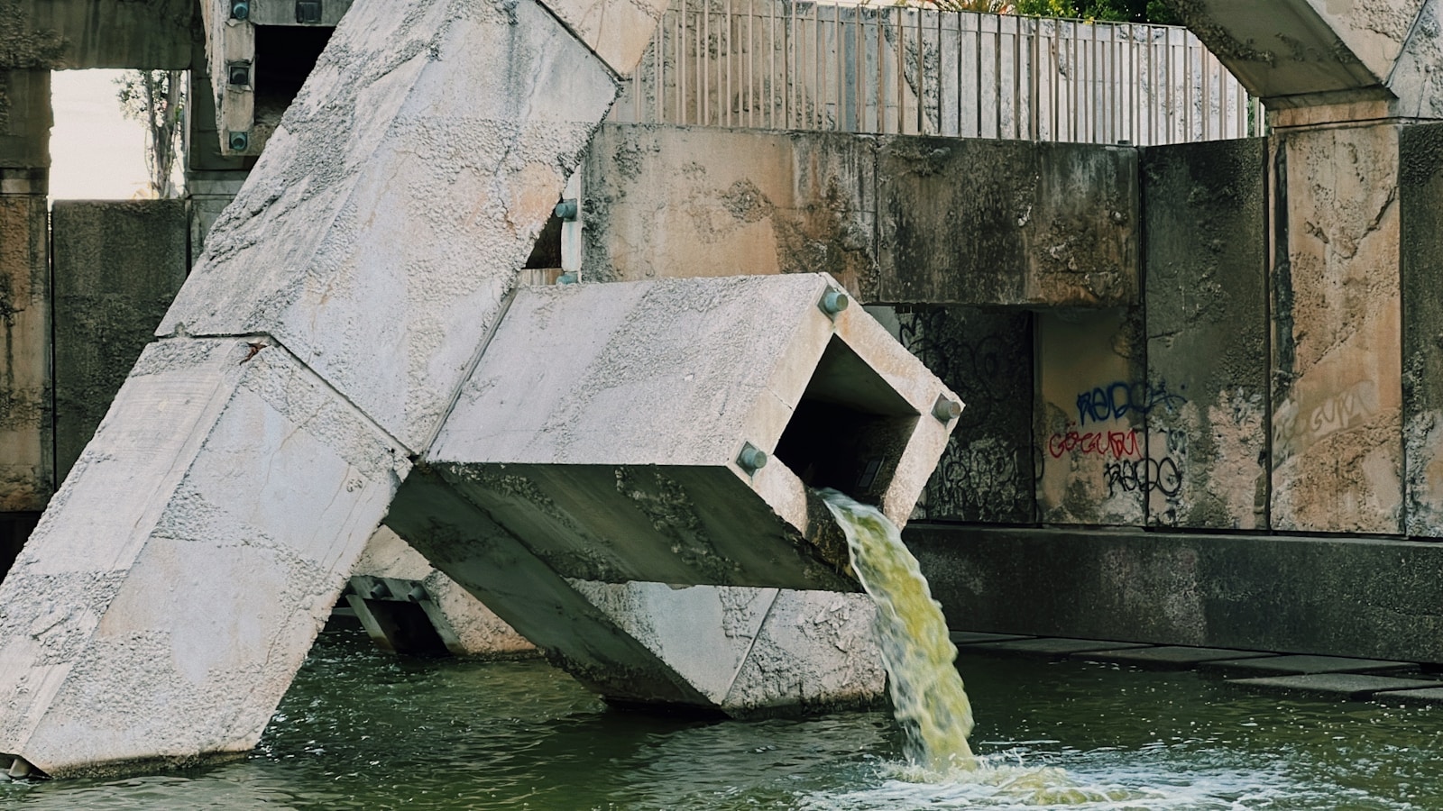 a concrete structure that has water coming out of it