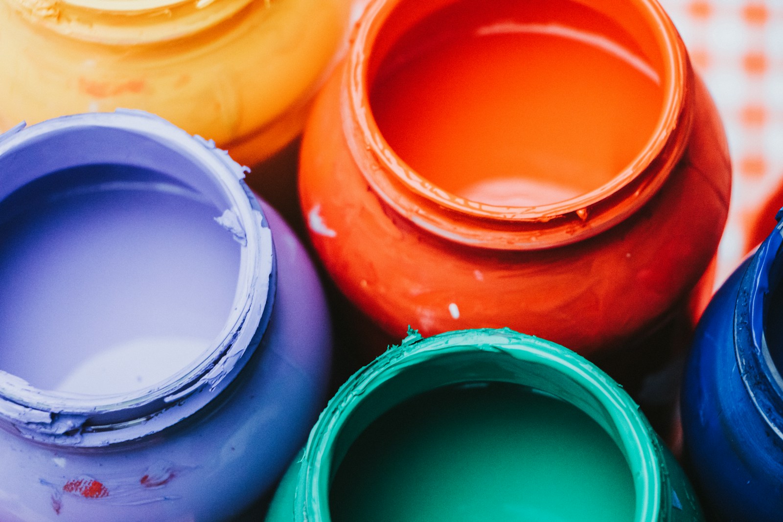 a close up of a group of paint cans